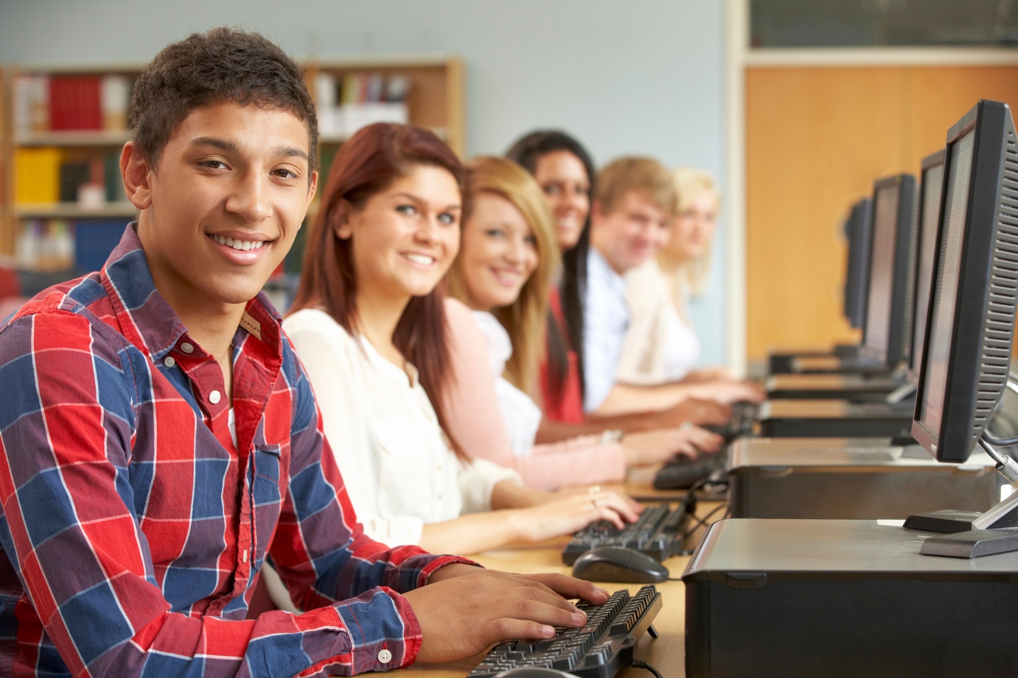 Students working on computers in library