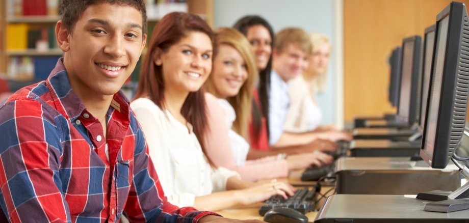 Students working on computers in library
