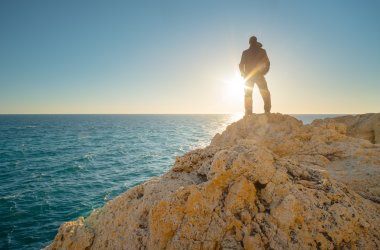 Man stands on the edge of the abyss